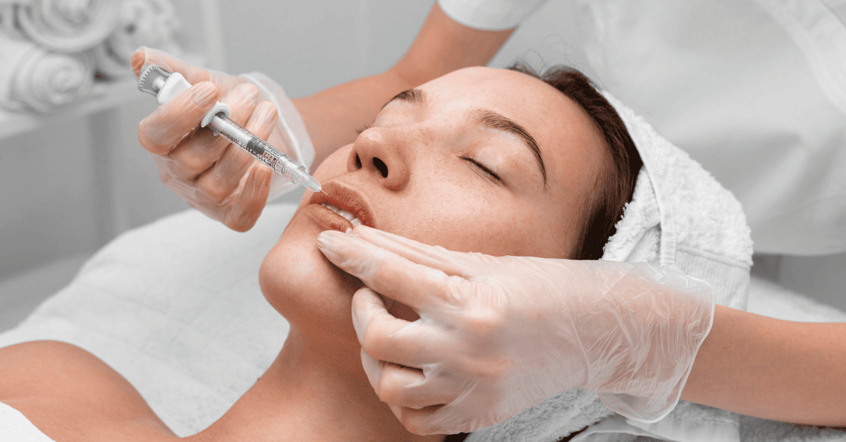 beautician doing injection filler female client